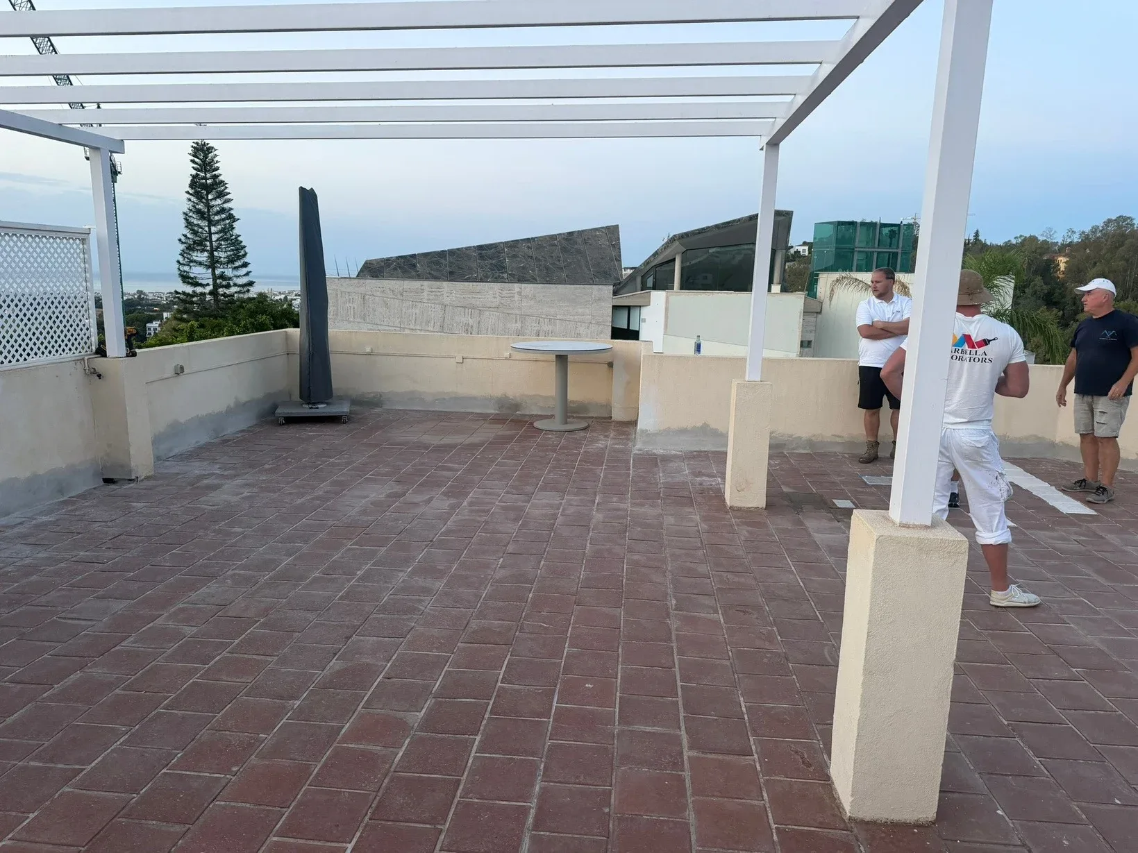 Marbella roof terrace before work: aged terracotta tiles