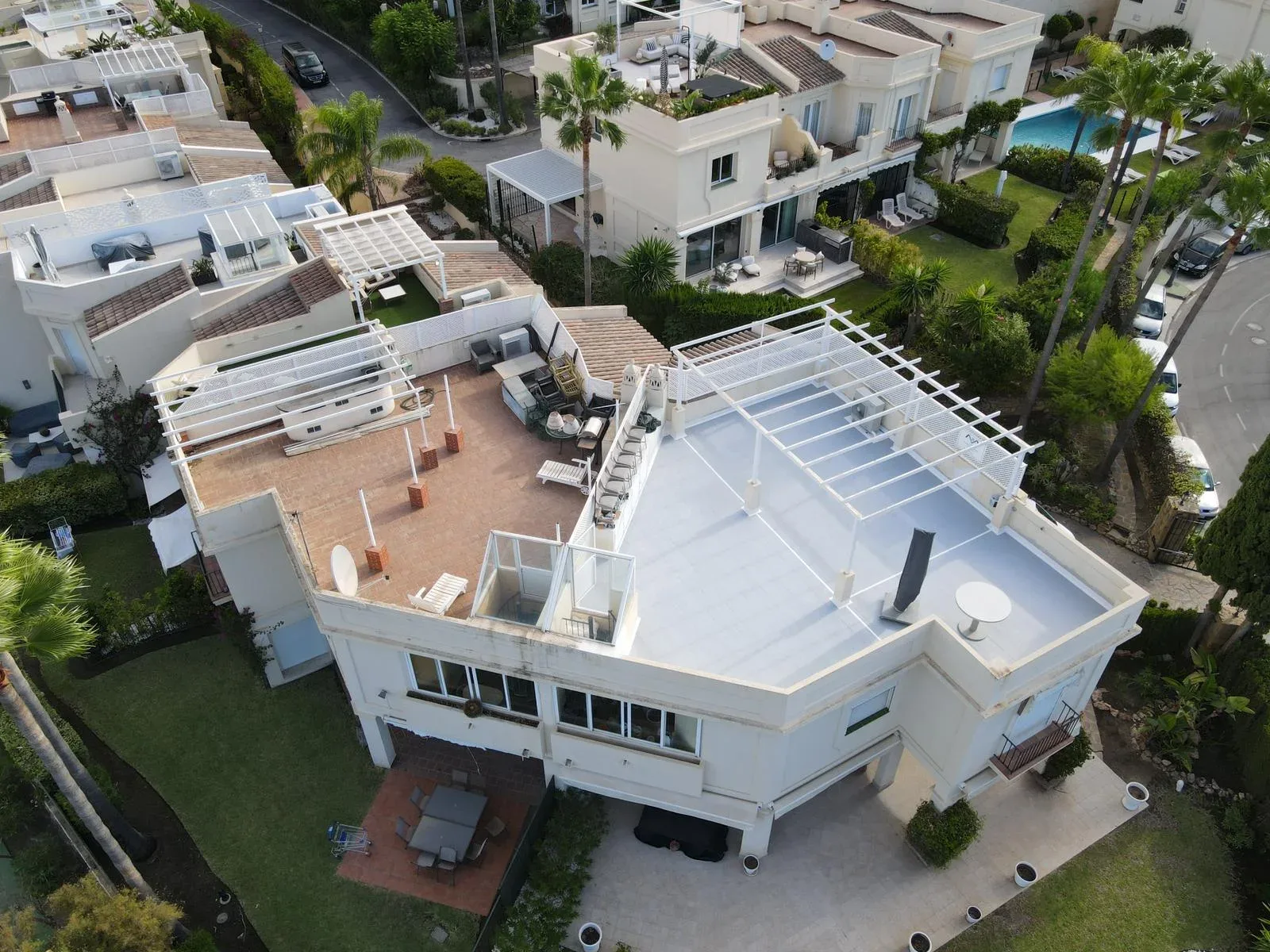 Drone view of the finished Marbella roof terrace beside the neighbouring tiled terrace