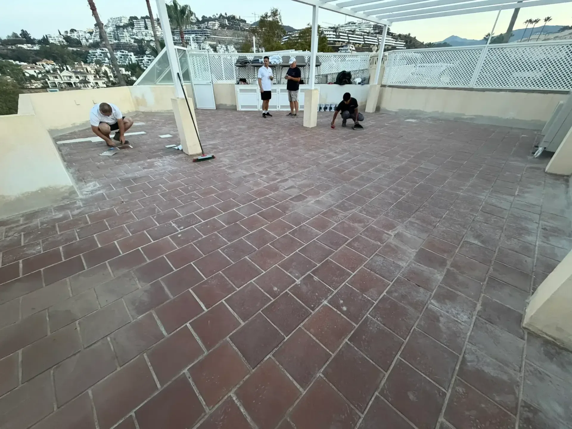 Marbella Roofing preparing the terracotta tiles before waterproofing
