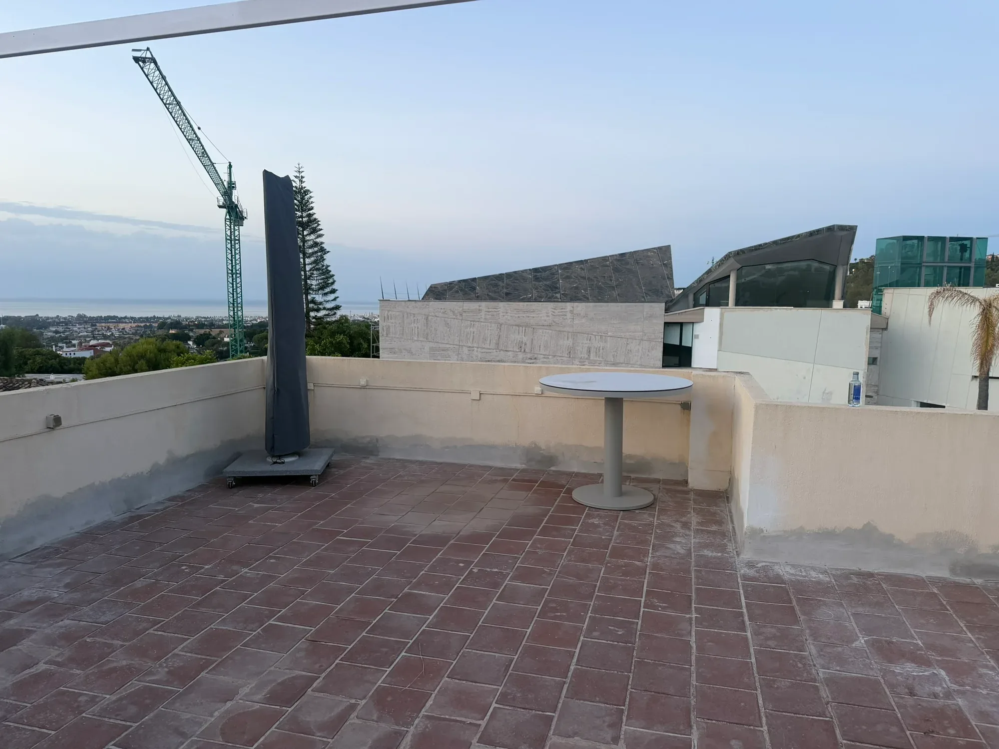 Marbella roof terrace before work, with the original terracotta tiles