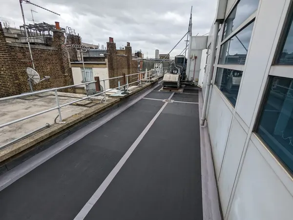 RESGRIP anti-slip coating in black, applied on a flat roof