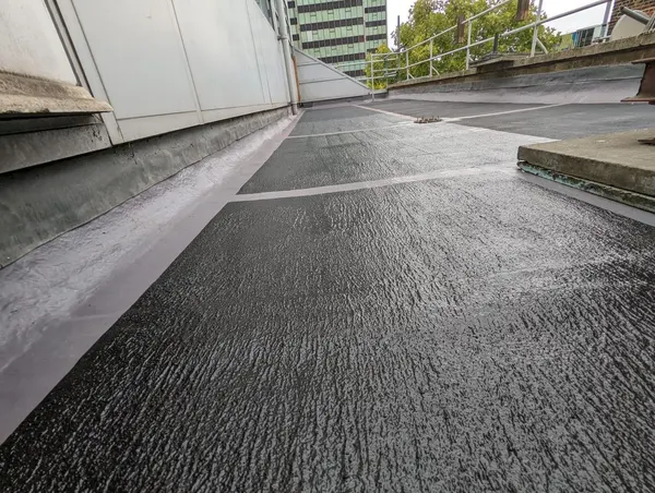 RESGRIP anti-slip coating in black, applied on a flat roof