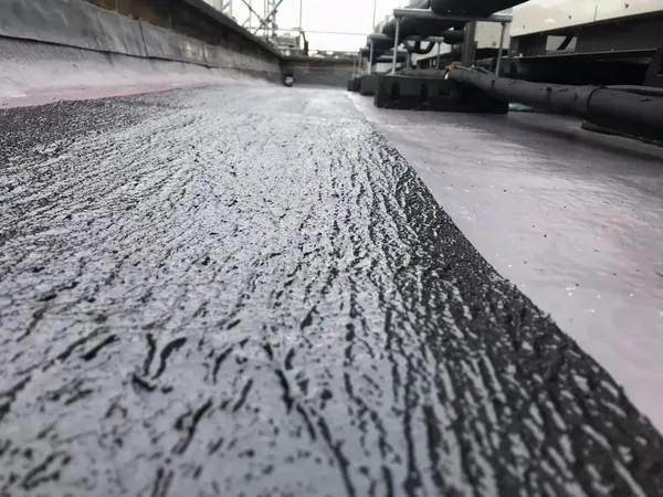 RESGRIP anti-slip coating in black, applied on a flat roof